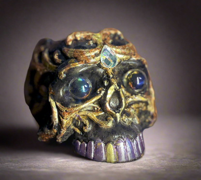 Decorative skull with gemstones on a dark background