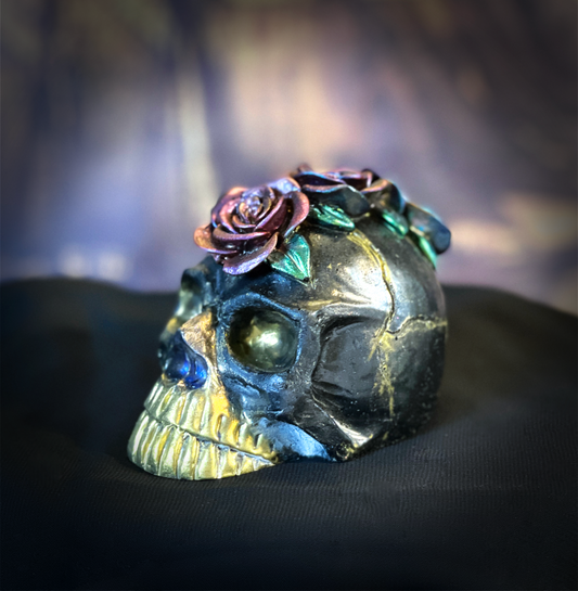 Decorative skull with roses on a dark background