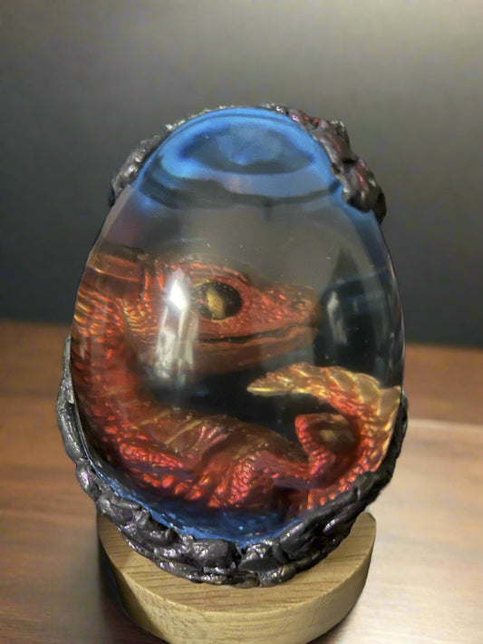 Decorative item with a dragon design on a dark background